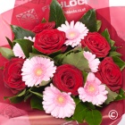  Six scented large headed red Roses with six pink gerbera, bound with foliage